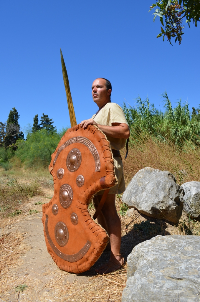 Mycaenean Anax (Land Lord), armed with Dipylon shield.  The shield reconstruction is based on a heavy frame (native Greek wicker wood) and heavy leather (cow). Additional decorated copper reinforcements are used on the exterior surface
